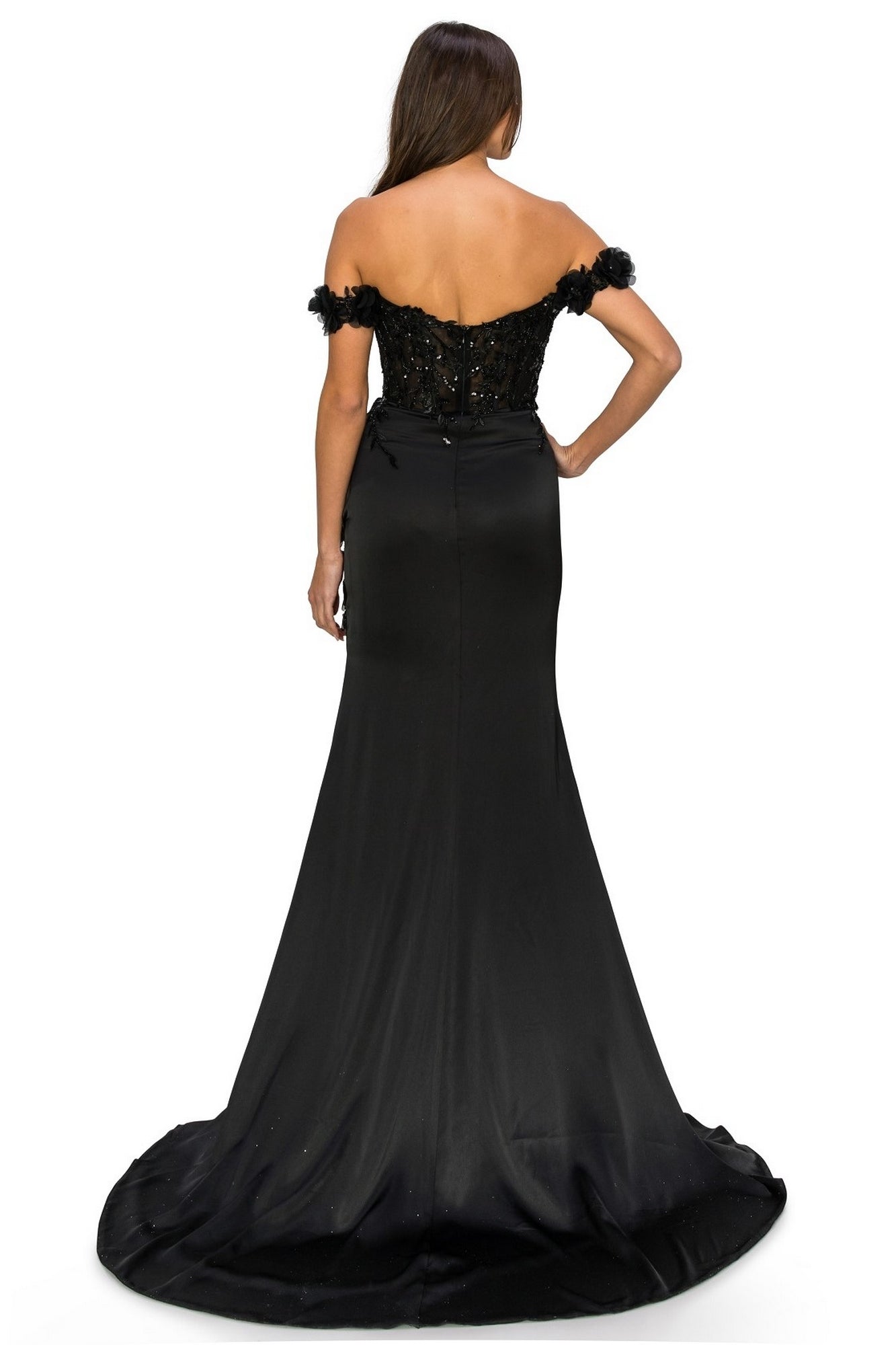 A woman stands facing away, wearing the Off-the-Shoulder Floral Embroidered Prom Dress 8050J, featuring a fitted bodice and a long, flared train.